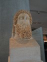 Greek sculpture with curly beard